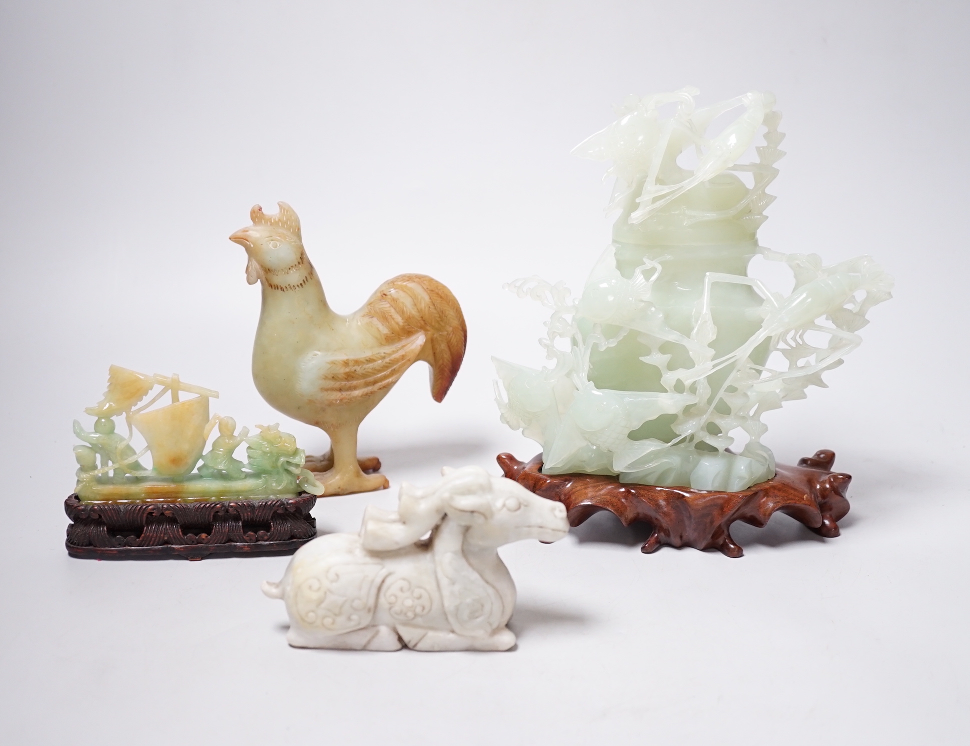 A group of four Chinese bowenite jade and hardstone carvings, the ‘sea creatures’ vase and cover, 18 cm high excluding wood stand